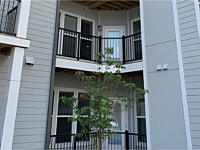 <b>Black Aluminum Balcony Railing in the corner of the courtyard at Monarch at Waugh Chapel in MD</b>